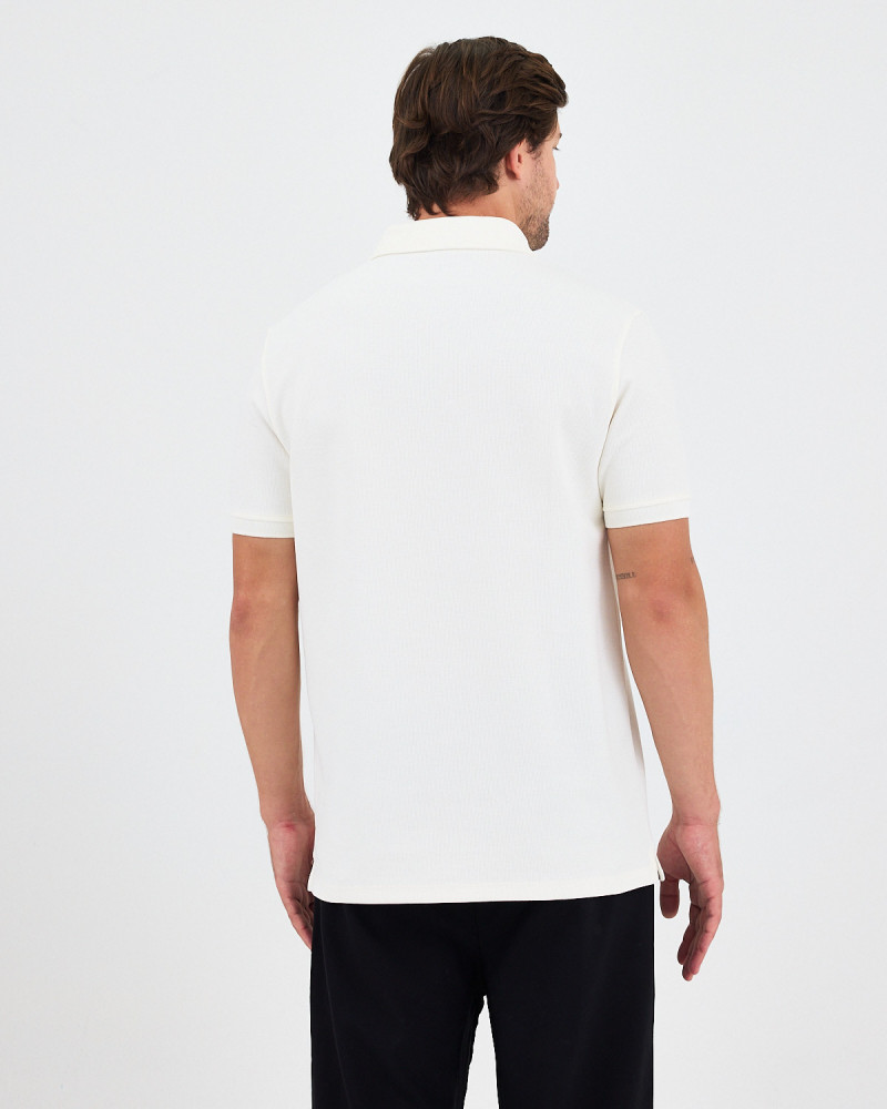 Unisex polo shirt with embroidered logo patch | "I AM A PATCH" collection
