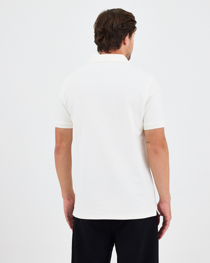 Unisex polo shirt with matching embroidered logo | "I Wasn't Here" Collection